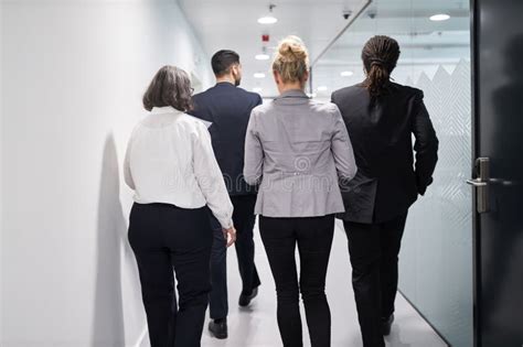 Business Team People Walk Together On The Office Corridor Stock Photo