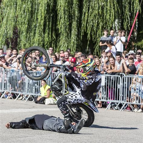 Moto Show In Central Square Of City Tricks On Atv Stuntmen Stunt Man