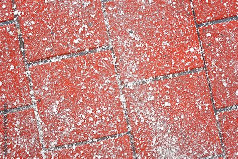 Salt Grains On Paving Slabs Closeup Sprinkle Salt On Icy Sidewalk