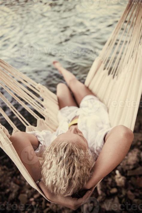Blonde Woman Resting On Hammock 10702892 Stock Photo At Vecteezy