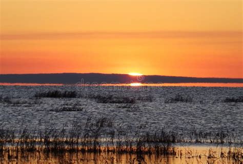 Sunrise by the lake stock photo. Image of sunrise, aquatic - 98971154