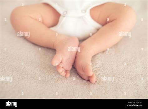 Legs Of New Born Baby Is Sleepin On The Bed Stock Photo Alamy