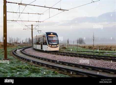 A tram rounds the corner at Ingliston Park & Ride, on it's way from Edinburgh Airport to York ...