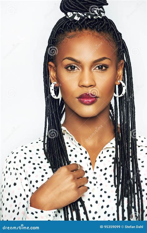 Young Black Woman Touching Her Traditional Bunches Hairstyle Stock ...