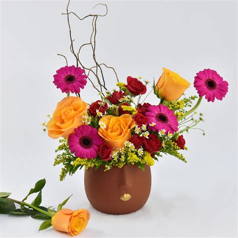 Online Chromatic Flowers Arrangement Gift Delivery in UAE - FNP