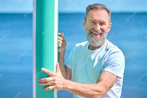 Premium Photo Delight Gray Haired Bearded Man Standing Touching