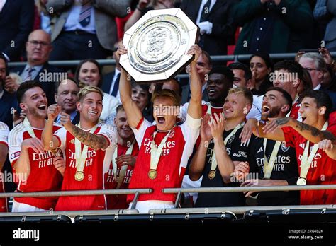 London Uk 6th Aug 2023 Martin Odegaard Of Arsenal Lifts The Trophy