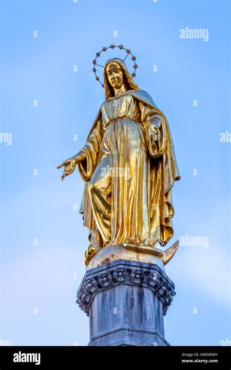 Virgin Mary golden statue Stock Photo - Alamy