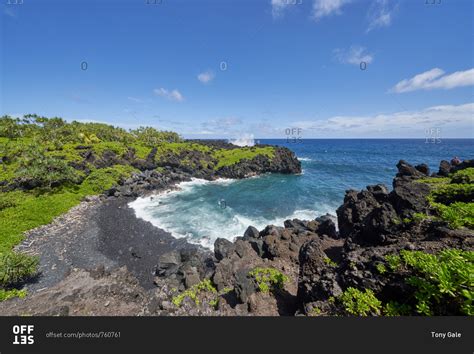 Waves Rolling Into The Rocky Coast Of Hana Maui Hawaii Stock Photo