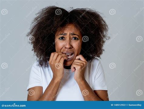 Young Attractive African American Woman Looking Scared And Shocked