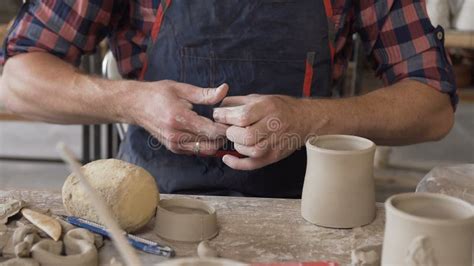 Potter S Hands Shaping Clay Into Vase On Wheel Indoors Side View Stock