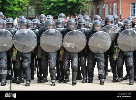 Riot Squad Police Officers Forming A Protective Barrier With Riot Stock