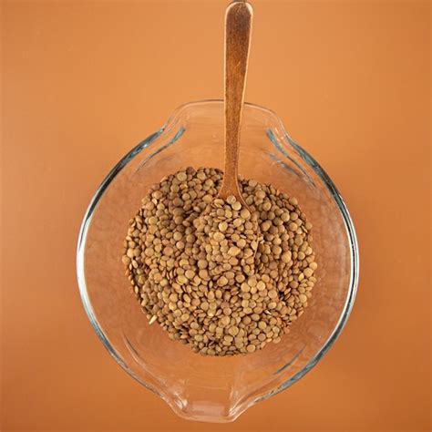 Premium Photo Lentils In A Bowl And Wooden Spoon