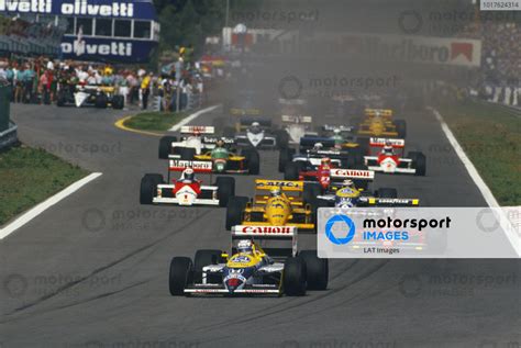 Nigel Mansell Williams FW11B Honda Leads Gerhard Berger Ferrari F1