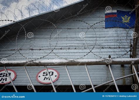 Prison Fence with Barbed Wire Stock Photo - Image of correctional ...