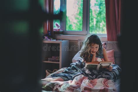 Thoughtful Kid Girl Reading Book Alone in Her Room Stock Image - Image ...