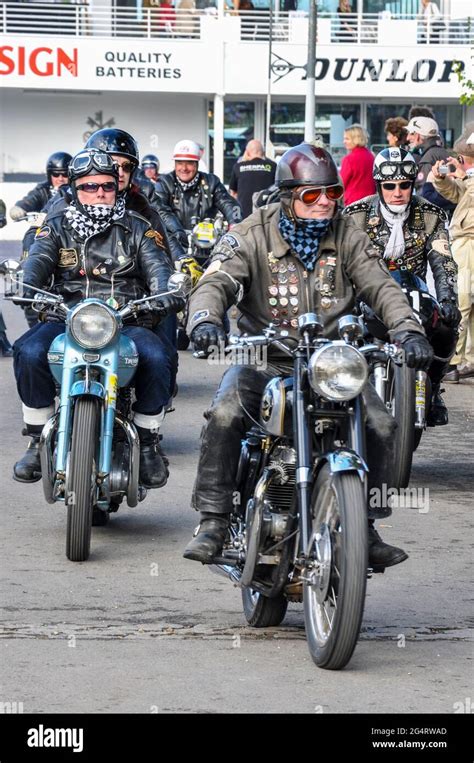 Motorcyclists In Vintage Motorcycle Clothing Riding Classic Motorbikes