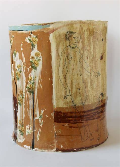 A Vase With Two Images On It And One Has Flowers In The Middle While