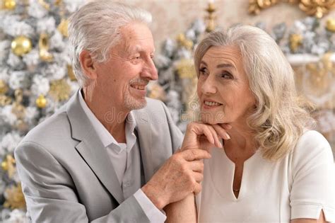 Couple Old And Mature Seniors Enjoying And Having Fun Together Celebrating The New Year Stock