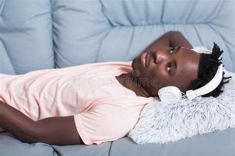 African American Man In Headphones Listening To Music Stock Image