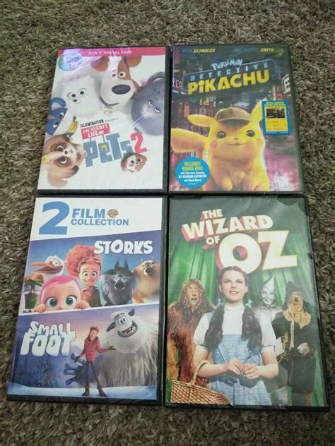 4 Dvd Movie Lot Wizard Of Oz Secret Life Of Pets Pikachu Storks