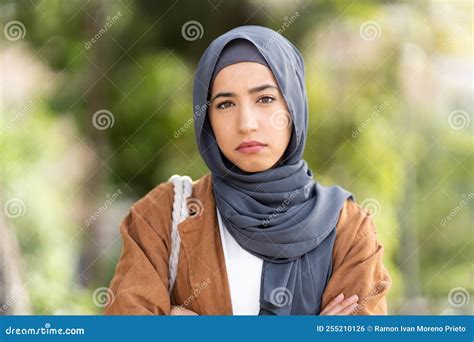 Serious Muslim Woman In Hijab Crossing The Arms Ourdoors Stock Photo