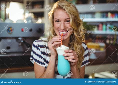 Portrait Of Woman Drinking Milkshake With A Straw Stock Image Image