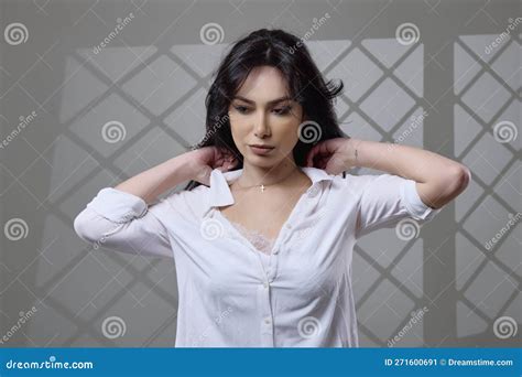 A Beautiful Brunette Woman In A Casual Outfit In The Studio Stock Image Image Of Lips