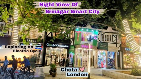 Exploring Smart City On Electric Cycle Night View Of Smart City