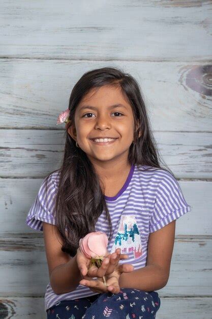 Premium Photo Cute Brunette Girl Playing With Pink Roses