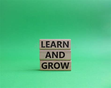 Learn and Grow Symbol. Concept Words Learn and Grow on Wooden Blocks ... 