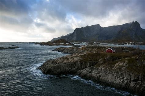 Traditional Fishing Hut Village In Hamnoy Mountain Peak In Lofoten