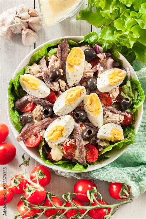 Nicoise Salad with tuna, anchovy, eggs and tomatoes Stock Photo | Adobe ...