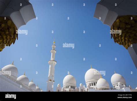 Brilliant White Marble Minaret And Domes Framed By An Archway At The