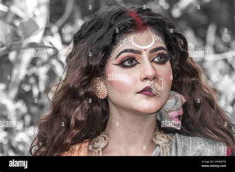 Portrait Of Beautiful Indian Brunette Woman Faces With Perfect Makeup And Wearing Jewelers With