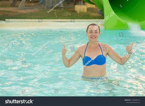 Стоковая фотография 1302838375 Happy Girl Bikini Sliding Water Park