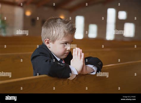 Boy Praying Catholic Church Hi Res Stock Photography And Images Alamy