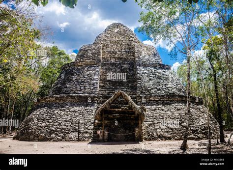 Ancient ruins and trees at the archaeological site of Coba Stock Photo ...