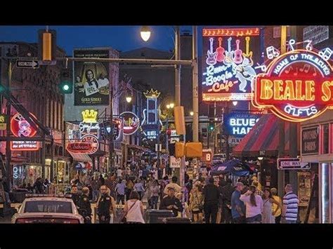 a busy city street filled with lots of neon signs