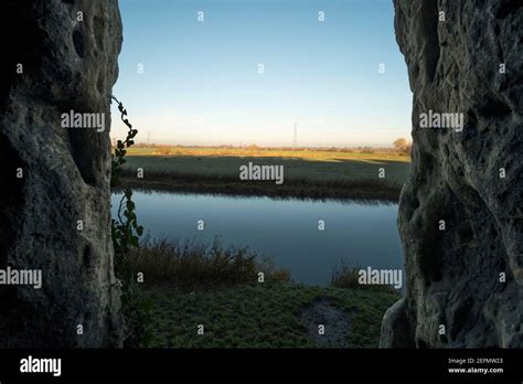 View Of Landscape From Inside A Cave Mouth Stock Photo Alamy