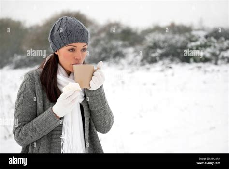 Cold Woman With Hot Drink Outside Holding Tissue Stock Photo Alamy