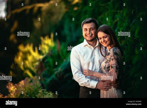 Beautiful young couple on a nature background Stock Photo - Alamy