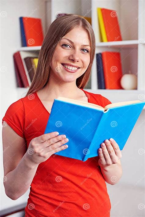 Young Woman Holding The Book And Smiling Stock Photo Image Of