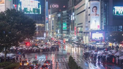 Tokyo Japan Night Time Lapse Of Tourist With Umbrella Walking At