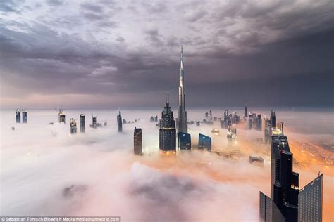 Incredible Photos Show Dubais Dazzling Skyline Above The Fog Burj