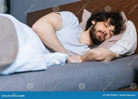 Close Up Low Angle View Of Bearded Young Man Sleeping Peacefully Lying