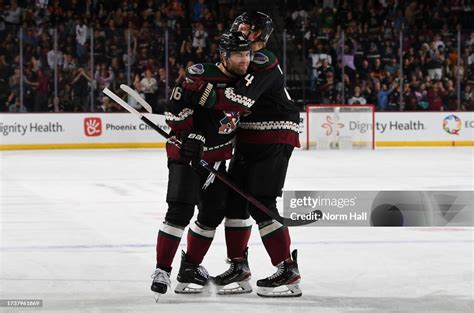 Jason Zucker Of The Arizona Coyotes Celebrates With Teammate Juuso