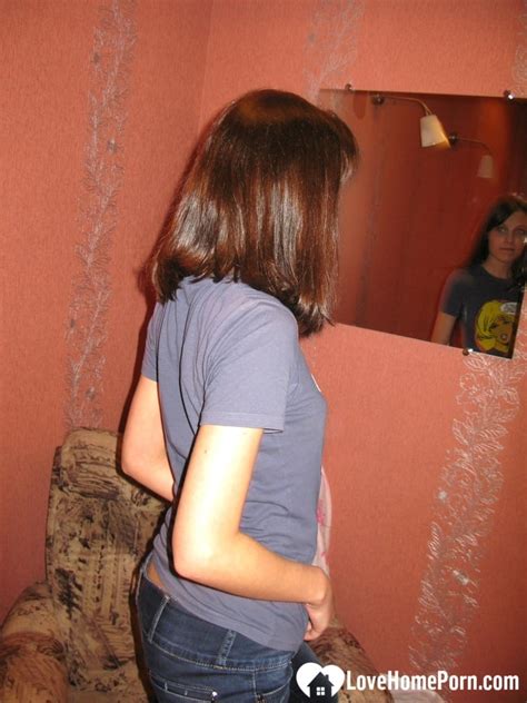 Delicious Brunette Amateur Poses Nude Dresses In Jeans After Taking A