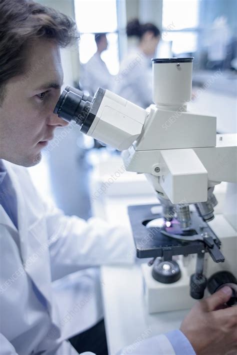 Lab Assistant Using Microscope Stock Image F022 8840 Science