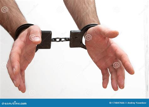 Handcuffed Hands Isolated On A White Background Stock Photo Image Of